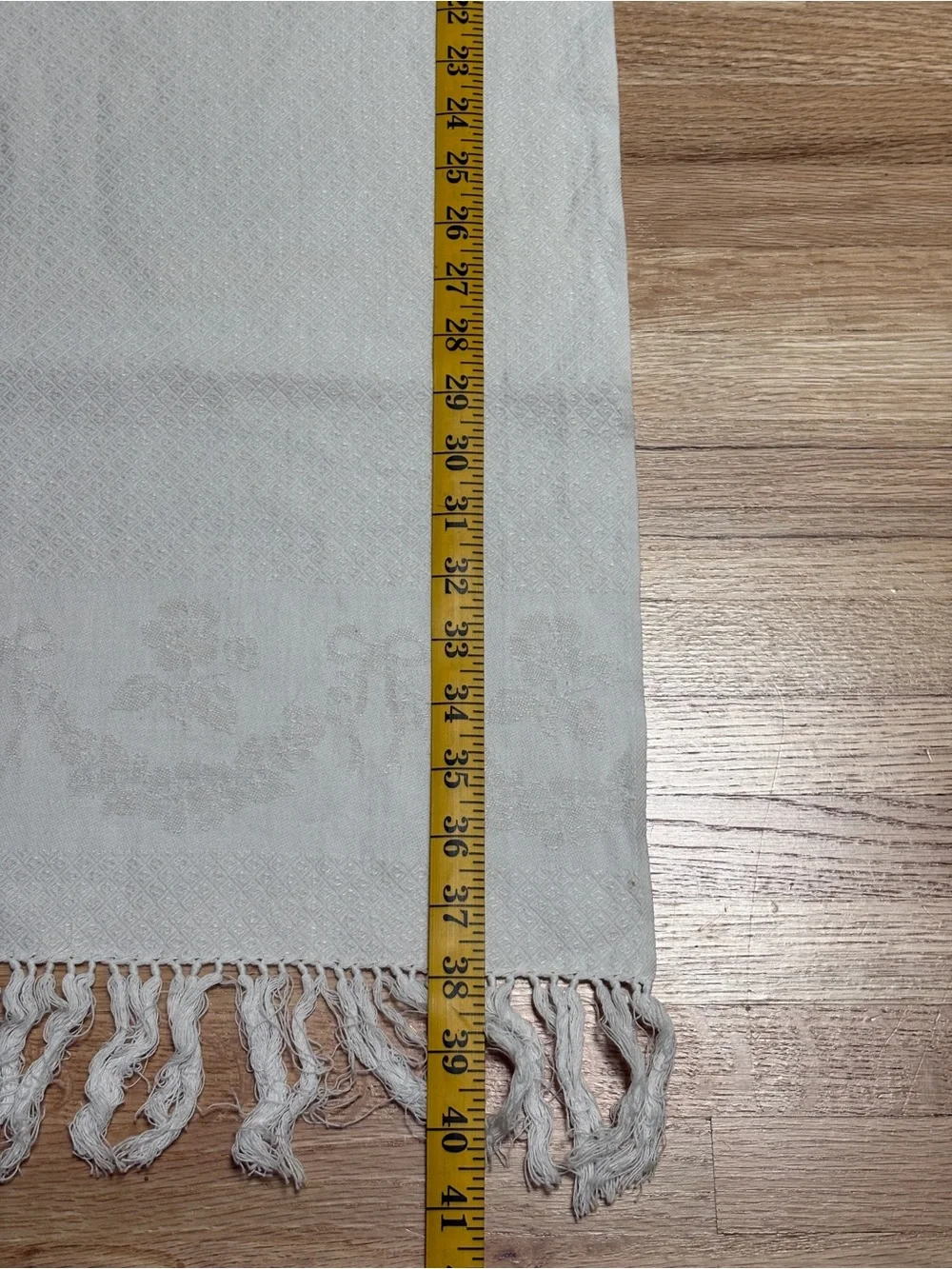 Textured off-white woven vintage towel set featuring decorative knotted fringe